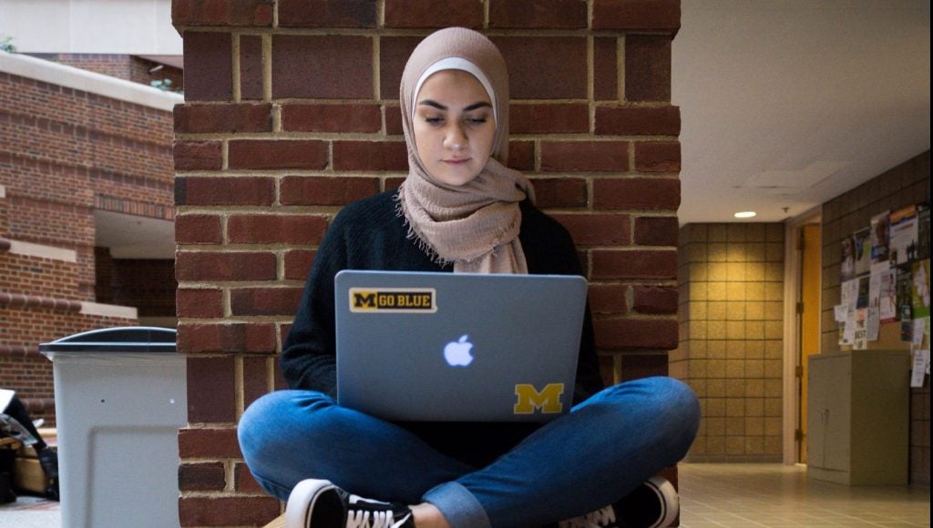 Student with laptop studying