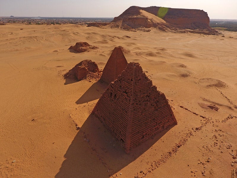 aerial view of small pyramids in the desert