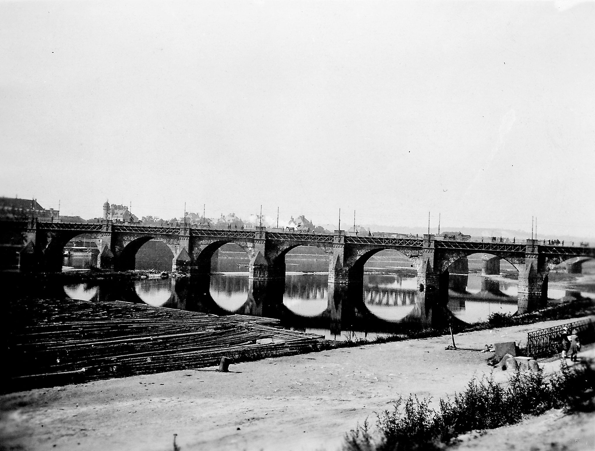 black and white photo of a stone bridge