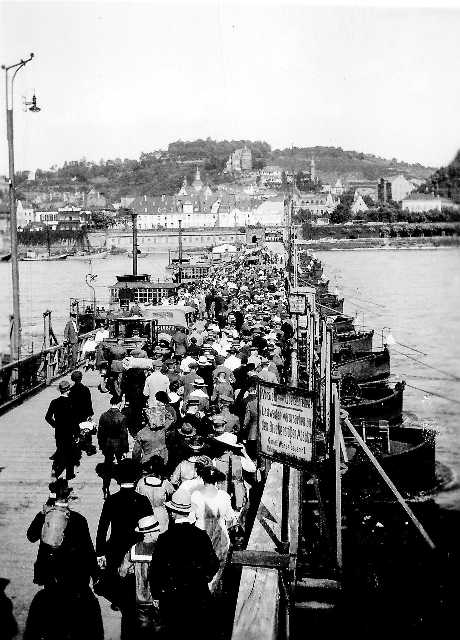 black and white photo of crowded bridge