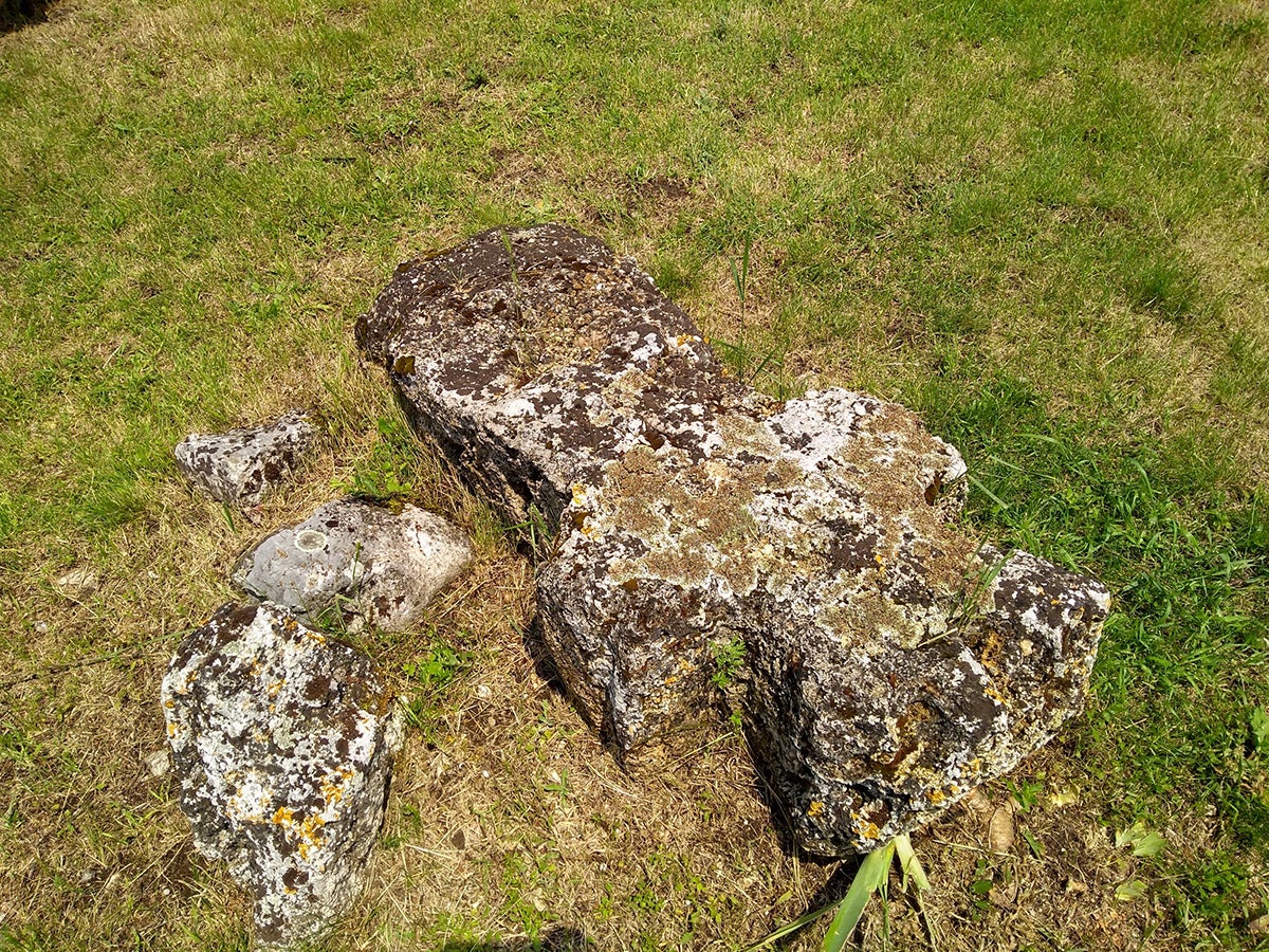 Stone cross grave marker.