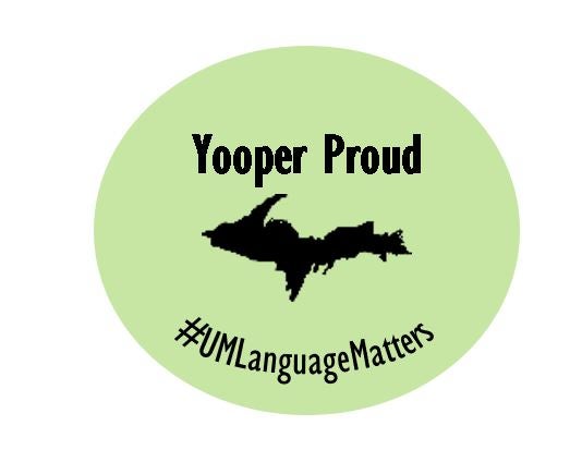 green circle with a silhouette of Michigan's Upper Peninsula with "Yooper Proud" written above and #UMLanguage Matters below