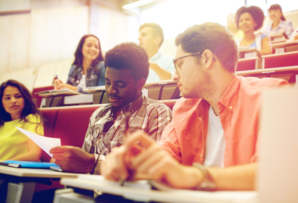 Group of international students in lecture hall.