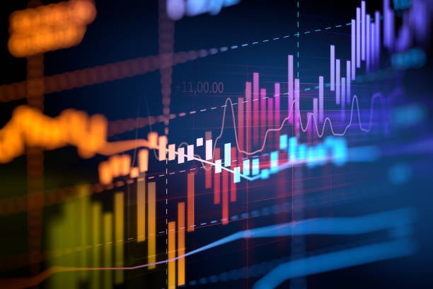 Colorful financial graphs and charts with lines and bar graphs representing market data trends on a dark background, suggesting economic analysis or stock market performance.