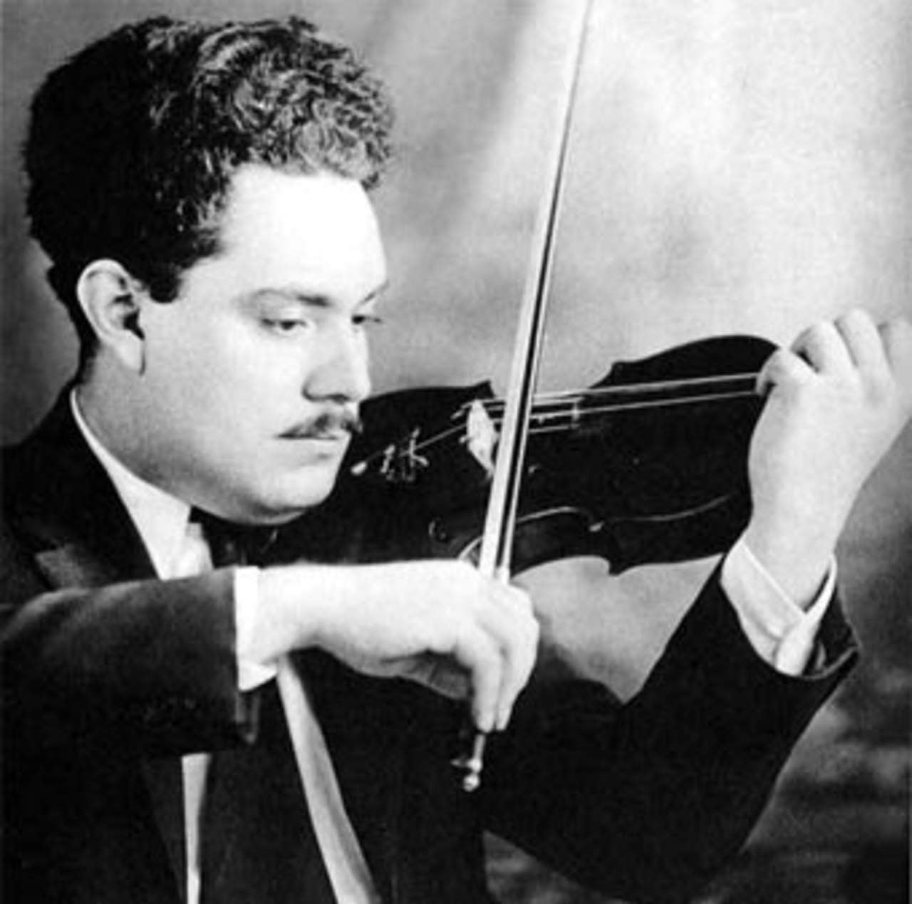B&W photo of Silvestre Revueltas playing the viola