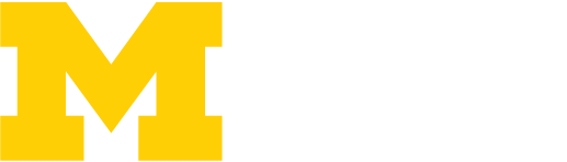 Large yellow block M next to faint white letters WCEE on a light gray background.